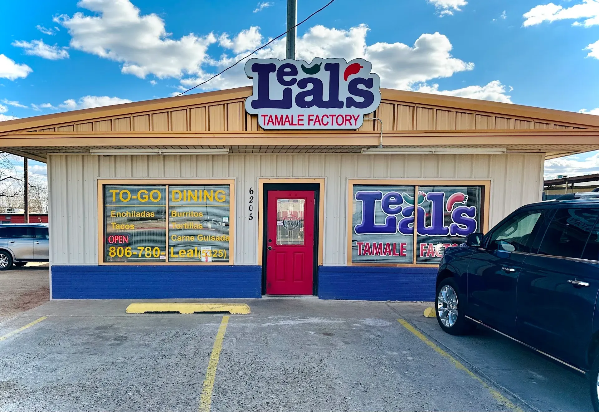 The Leal's Tamale Factory storefront at 6205 19th Street, Lubbock — yellow building with the Leal's master logo above the front entrance